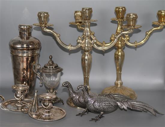 A plated cocktail shaker, pair of chambersticks, pair of pheasants, pair of candelabra, etc.